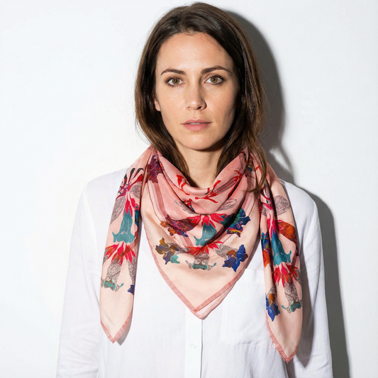Model wearing American Folk Art 1.4 silk scarf tied at neck with white shirt by Leeloo + Zohan — Square Scarf