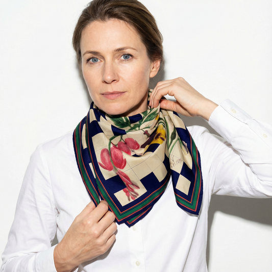 Model wearing M.M.V. 5.11.1876 silk scarf as neck tie with botanical floral checkerboard design by Leeloo + Zohan