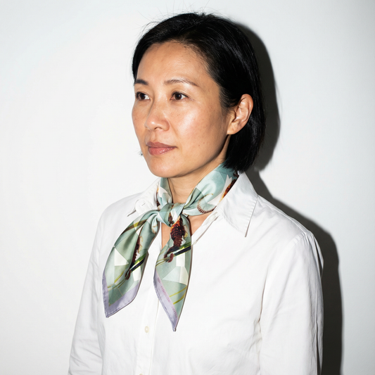 Model wearing Sea-horse, New York Aquarium silk scarf as neck wrap by Leeloo + Zohan