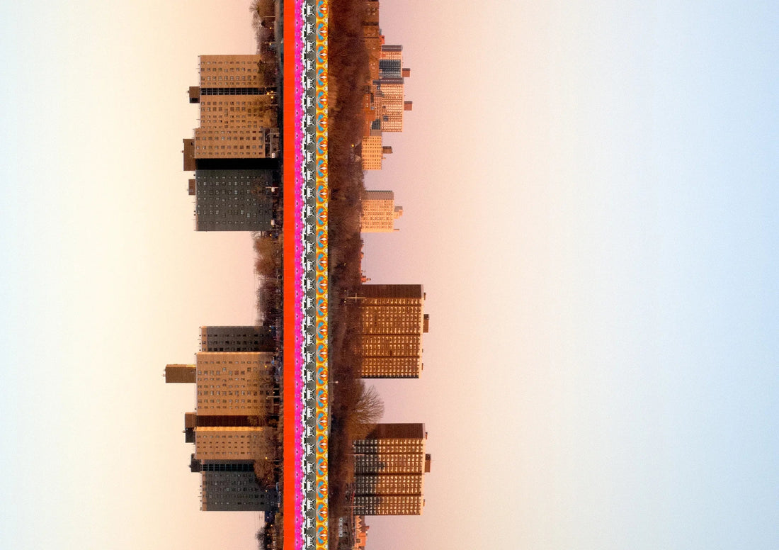 A framed New York City skyline art print displayed on a wall.—Journal