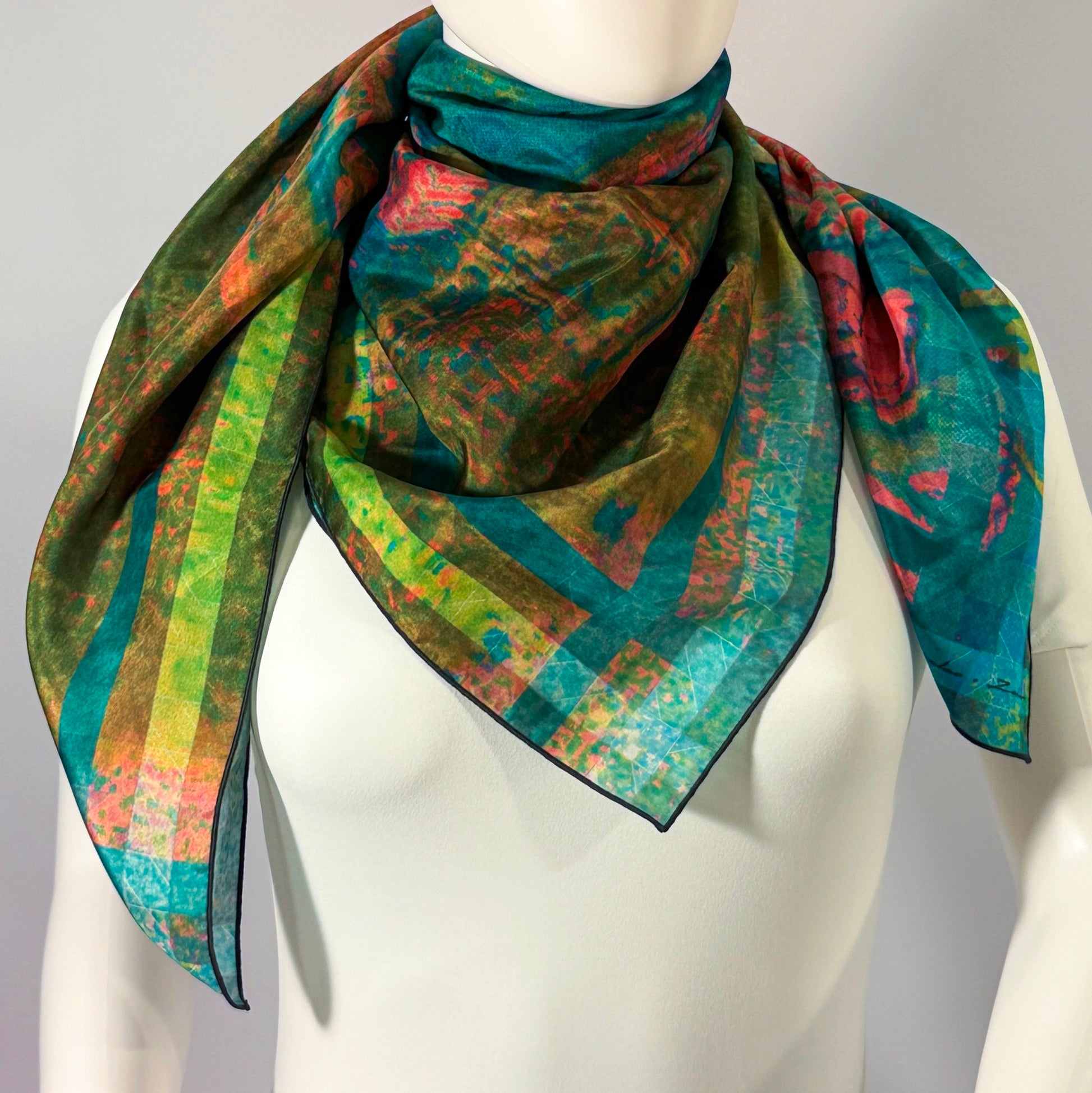Loeb Boathouse silk scarf tied at the neck on a form — boathouse and lake landscape in teal and green.—Square Scarf