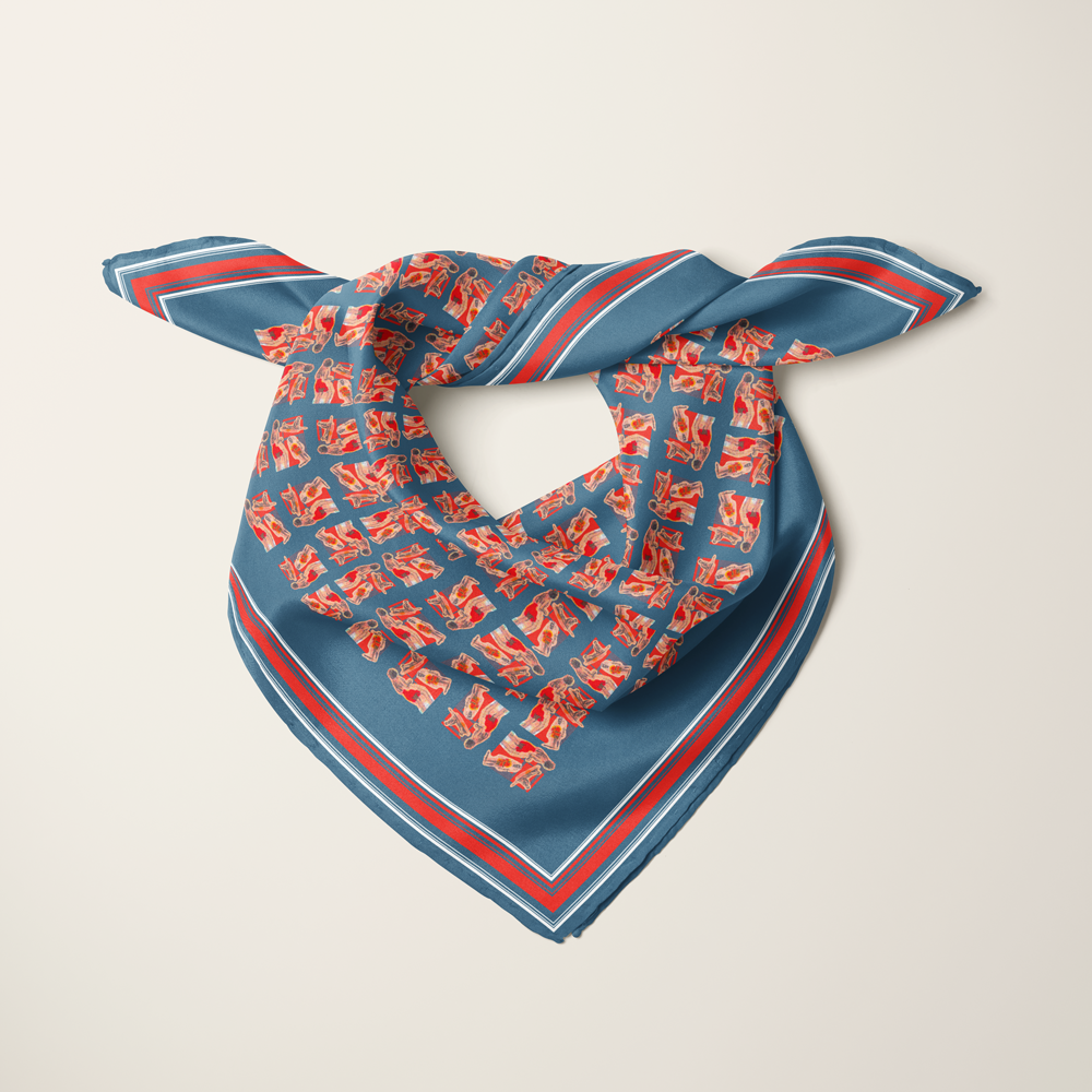Beach People, Navy silk scarf knotted as a neckerchief — navy ground with coral figures and a striped border.