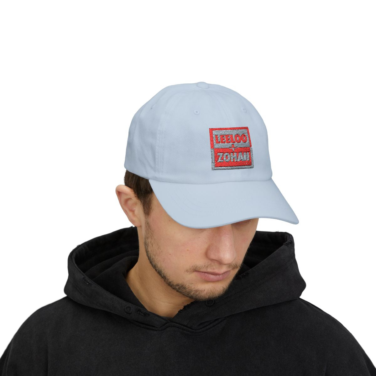 Model wearing Leeloo + Zohan Classic Dad Cap in light blue with embroidered logo patch by Leeloo + Zohan—Hats