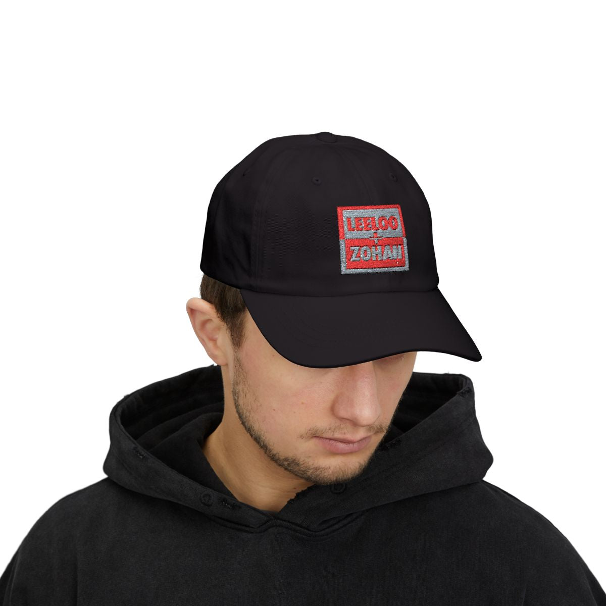 Model wearing Leeloo + Zohan Classic Dad Cap in black with embroidered logo patch by Leeloo + Zohan—Hats