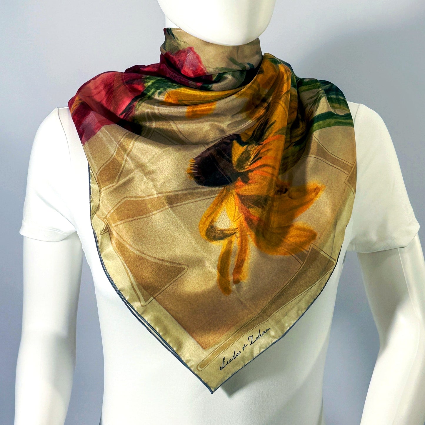 On The Plains & Chicago silk scarf (shown on form, 36") — draped styling detail.
