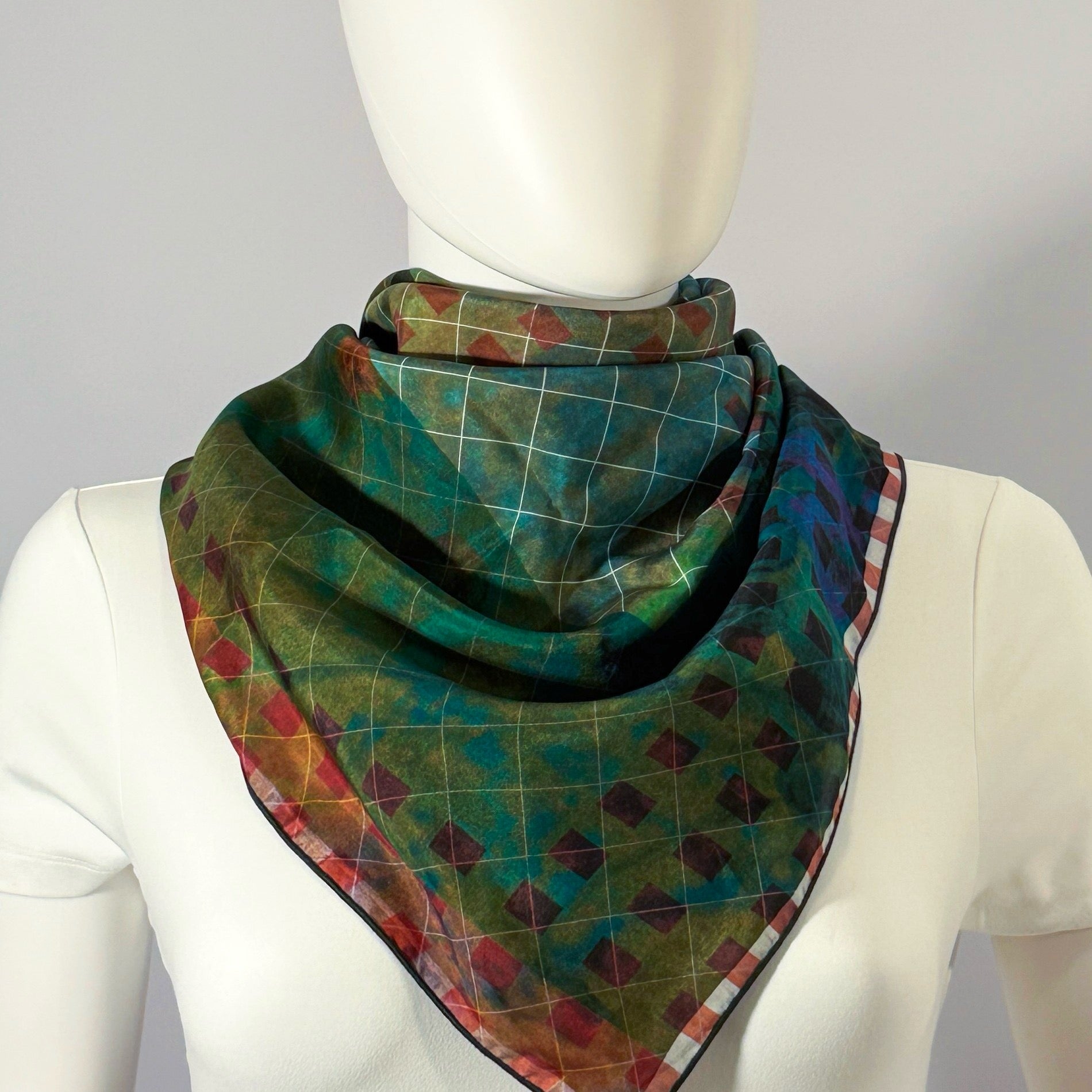 Wildflower Meadow silk scarf tied at the neck — shown on form.—Square Scarf
