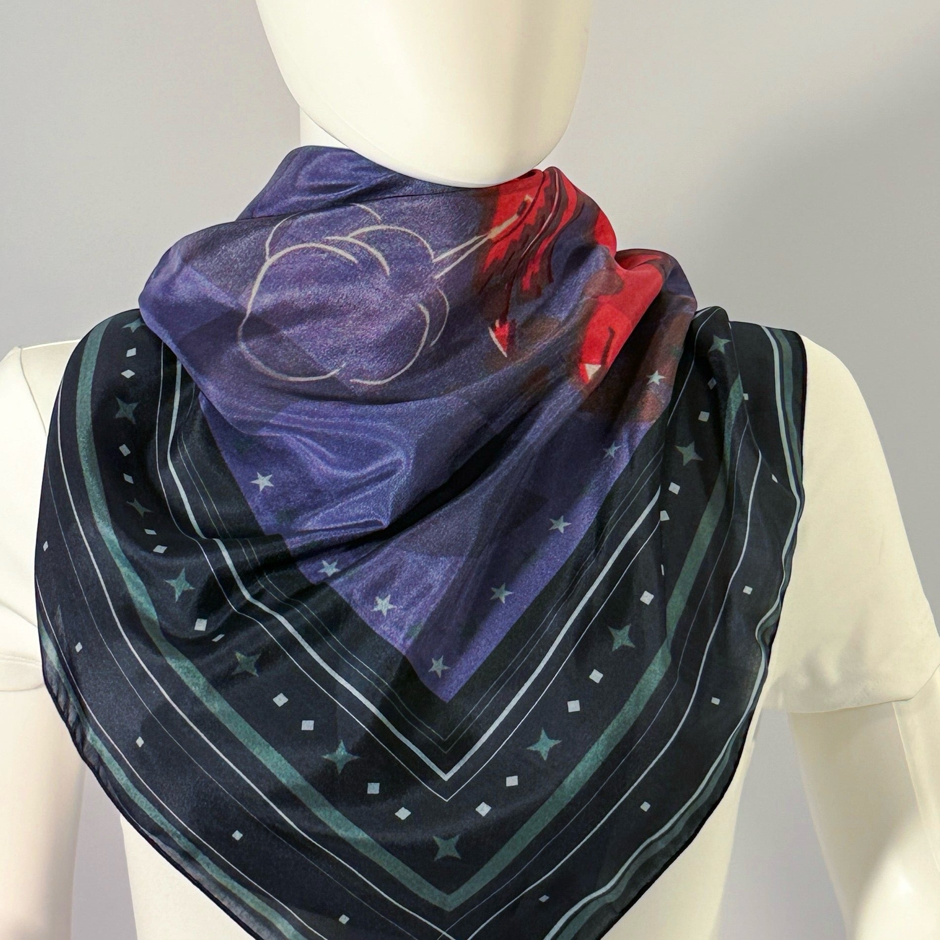 Dragon Egg Adventure silk scarf tied at the neck — shown on form.—Square Scarf