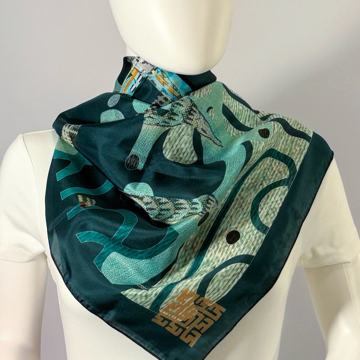 Egyptian P. Chrysler silk scarf tied at the neck — shown on form.
