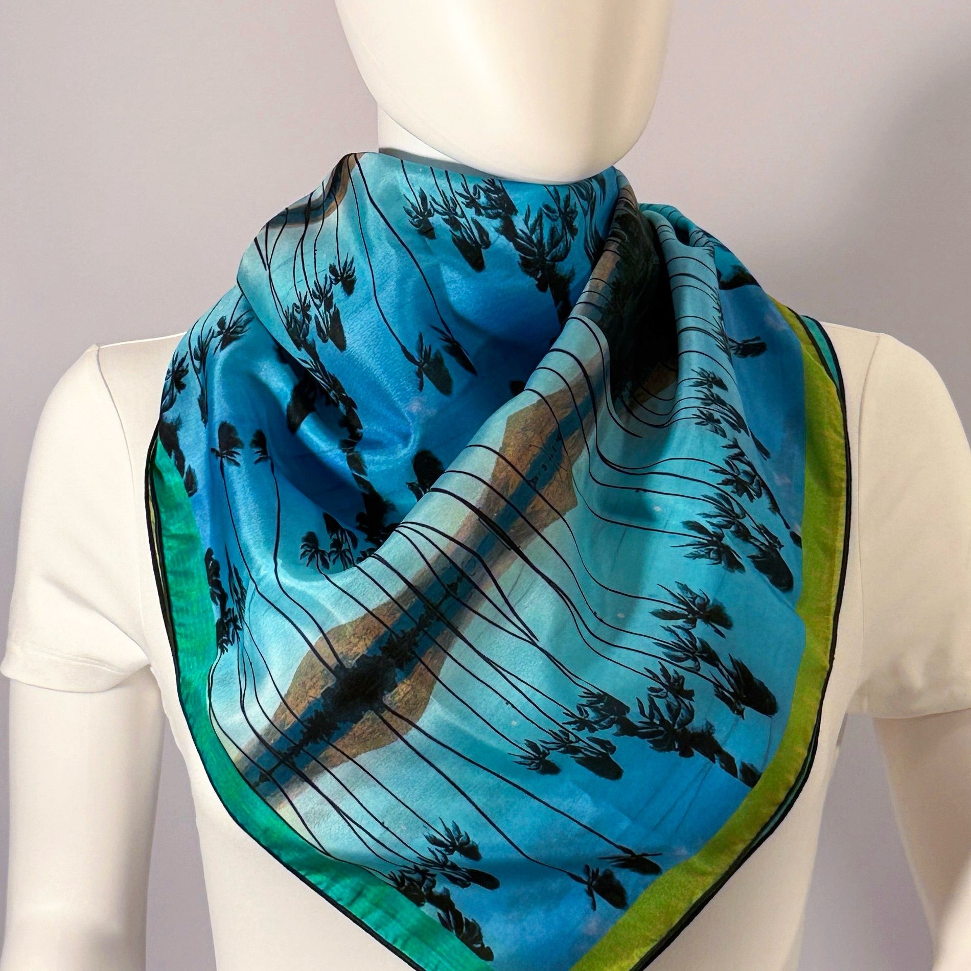 Haleakalā Moonrise silk scarf tied at the neck — shown on form.—Square Scarf
