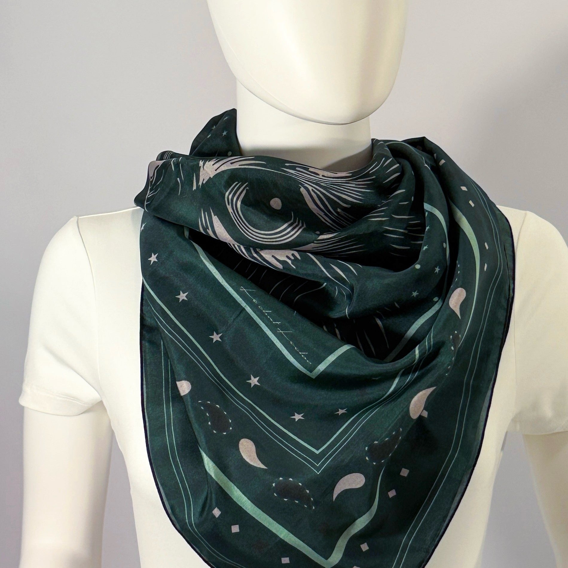 Le Chat Leeloo silk scarf tied at the neck — shown on form.—Square Scarf