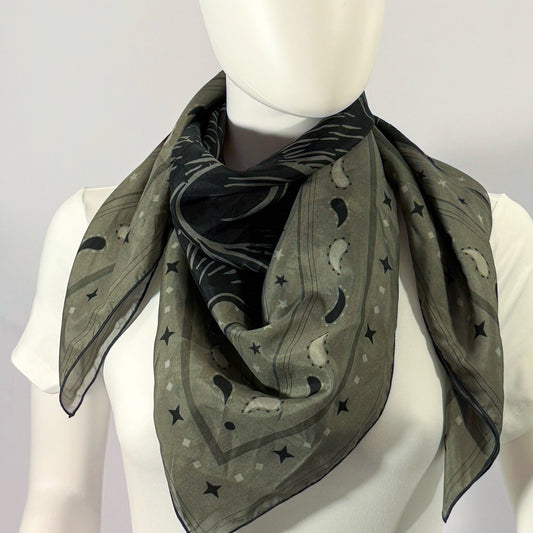 Le Chat Zohan silk scarf tied at the neck — shown on form.—Square Scarf