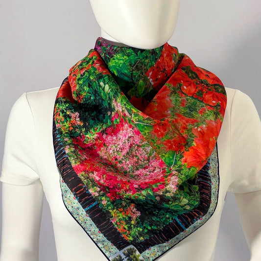 Mākena Bloom silk scarf tied at the neck — shown on form.—Square Scarf