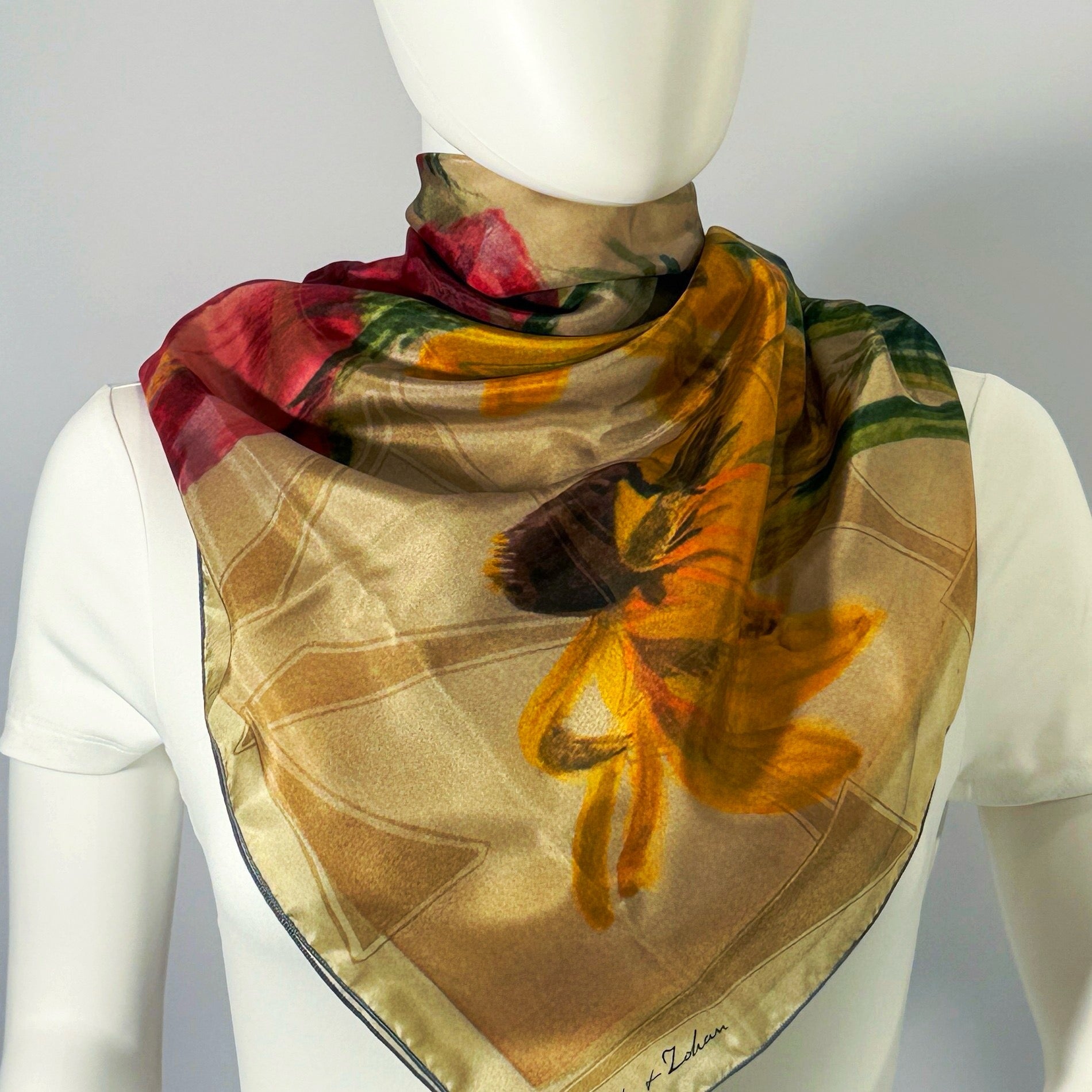 On The Plains & Chicago silk scarf tied at the neck — shown on form.—Square Scarf